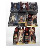 Three Disney Store Star Wars figurines, two further Black Series figurines,