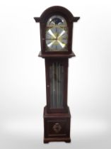 A reproduction mahogany grandmother clock with brass moon phase dial, with pendulum and weights,