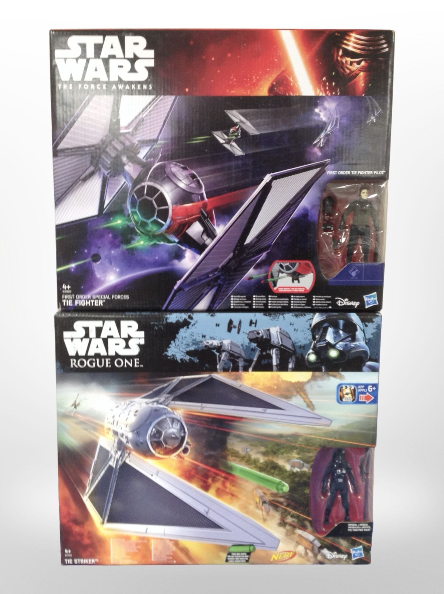 Three Hasbro Disney Star Wars figures, Tie Fighter and Tie Striker, boxed.