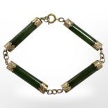 A gold-mounted jadeite bracelet, length 19.