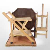 An oak octagonal folding table, folding easel,