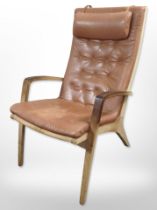 A Schou Andersen Mobelfabrik oak-framed tan leather upholstered armchair.