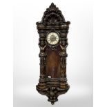 An impressive Victorian-style carved wall clock, length 145cm.