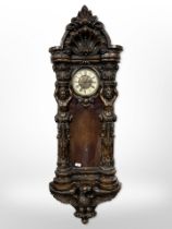 An impressive Victorian-style carved wall clock, length 145cm.