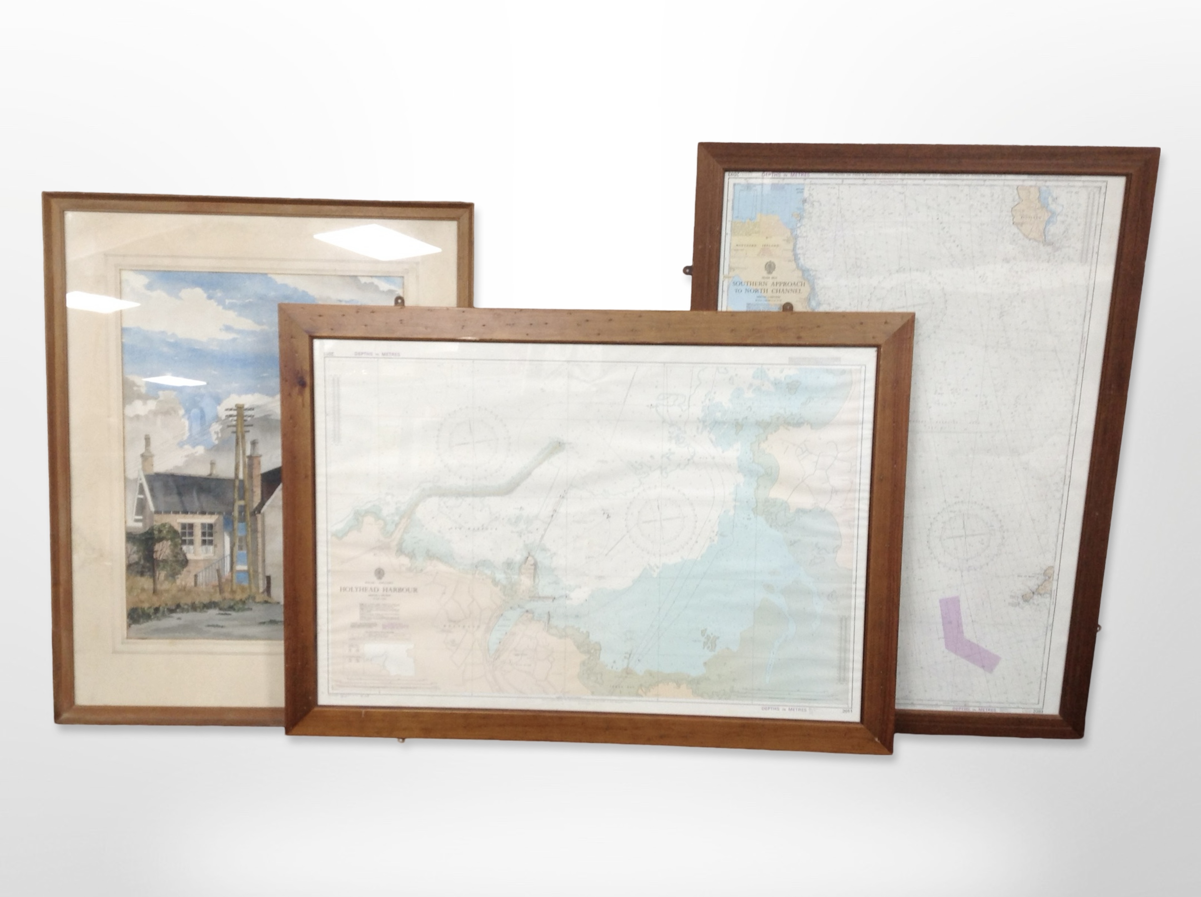 Two pine-framed nautical maps and a watercolour by G J Gilmore, 72cm x 53cm.