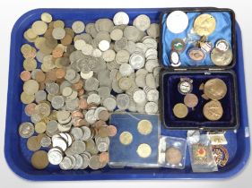 A collection of British pre-decimal coins and foreign coins, enamelled badges, coronation medals,