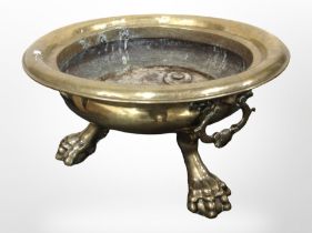 A large 19th century brass brazier on claw and ball feet, diameter 58cm.