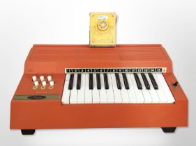 A Magnus Major electric chord organ,