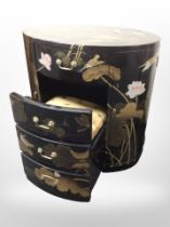A contemporary Japanese-style lacquered and gilt oval cabinet fitted four drawers and two cupboards,