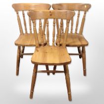 A contemporary set of six pine spindle back chairs.
