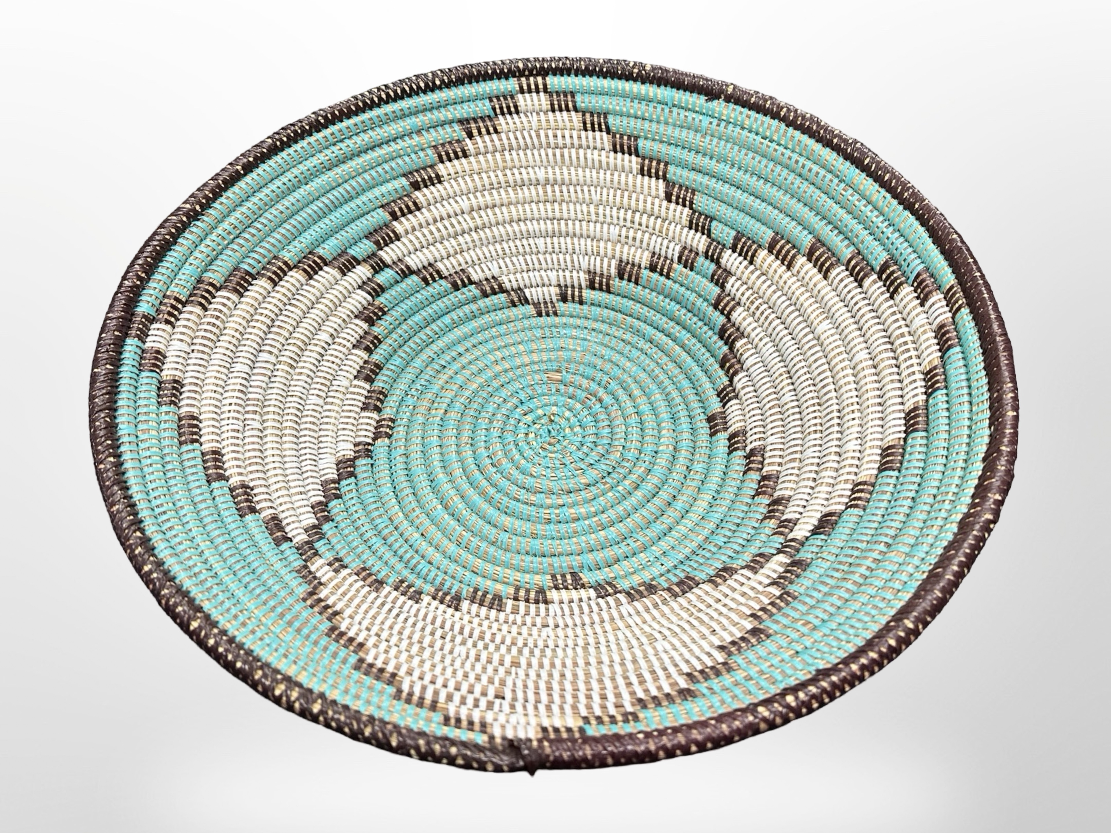 A large West African wicker circular bowl, diameter 45cm.