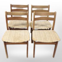 A set of four 20th-century Danish teak-framed dining chairs.
