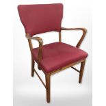 A continental walnut open armchair in red upholstery