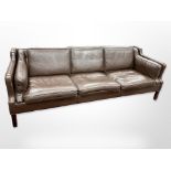 A late 20th-century Danish chocolate brown leather three-seater settee,