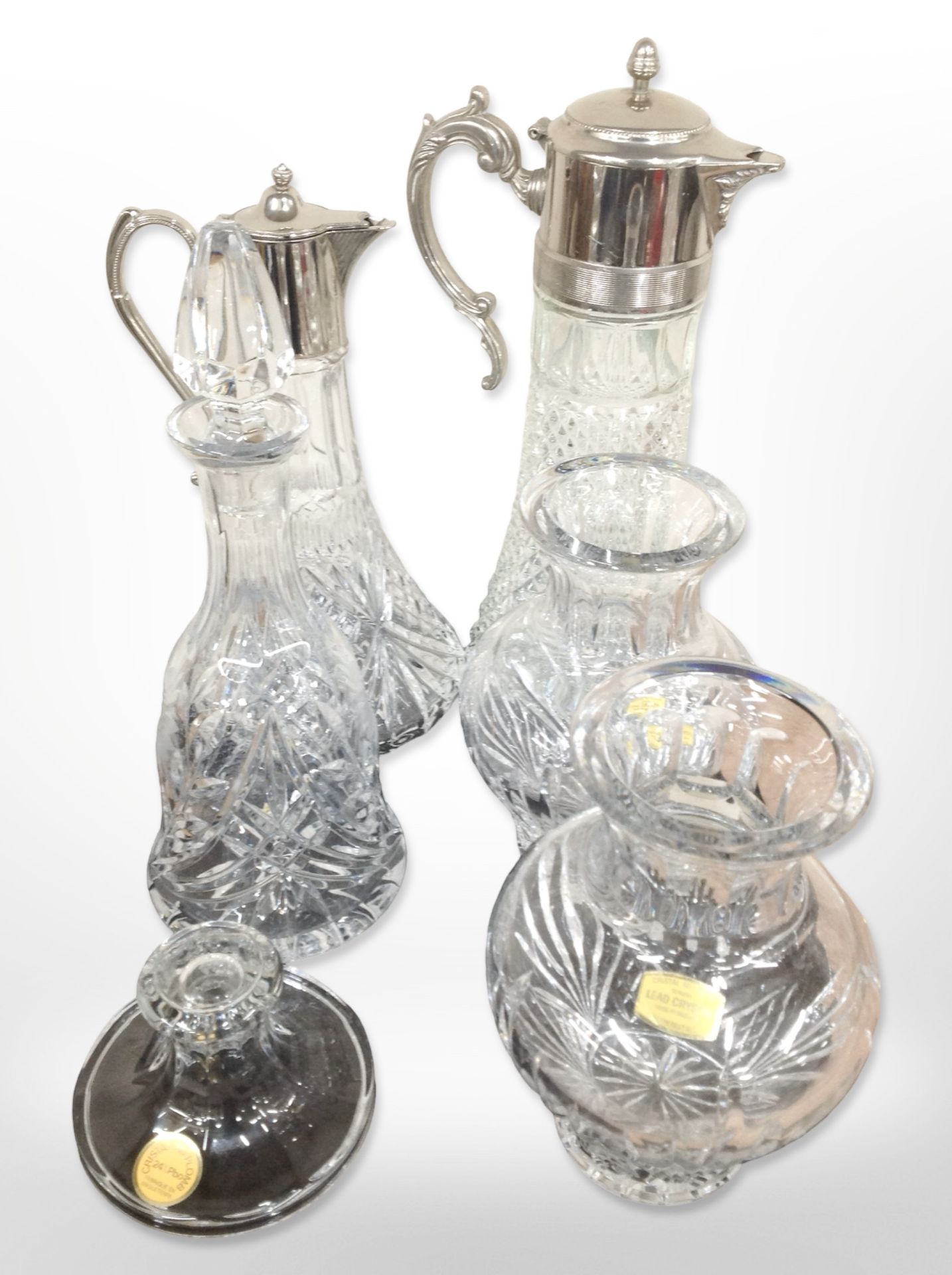 Two claret jugs with silver-plated lids, together with four pieces of lead crystal.
