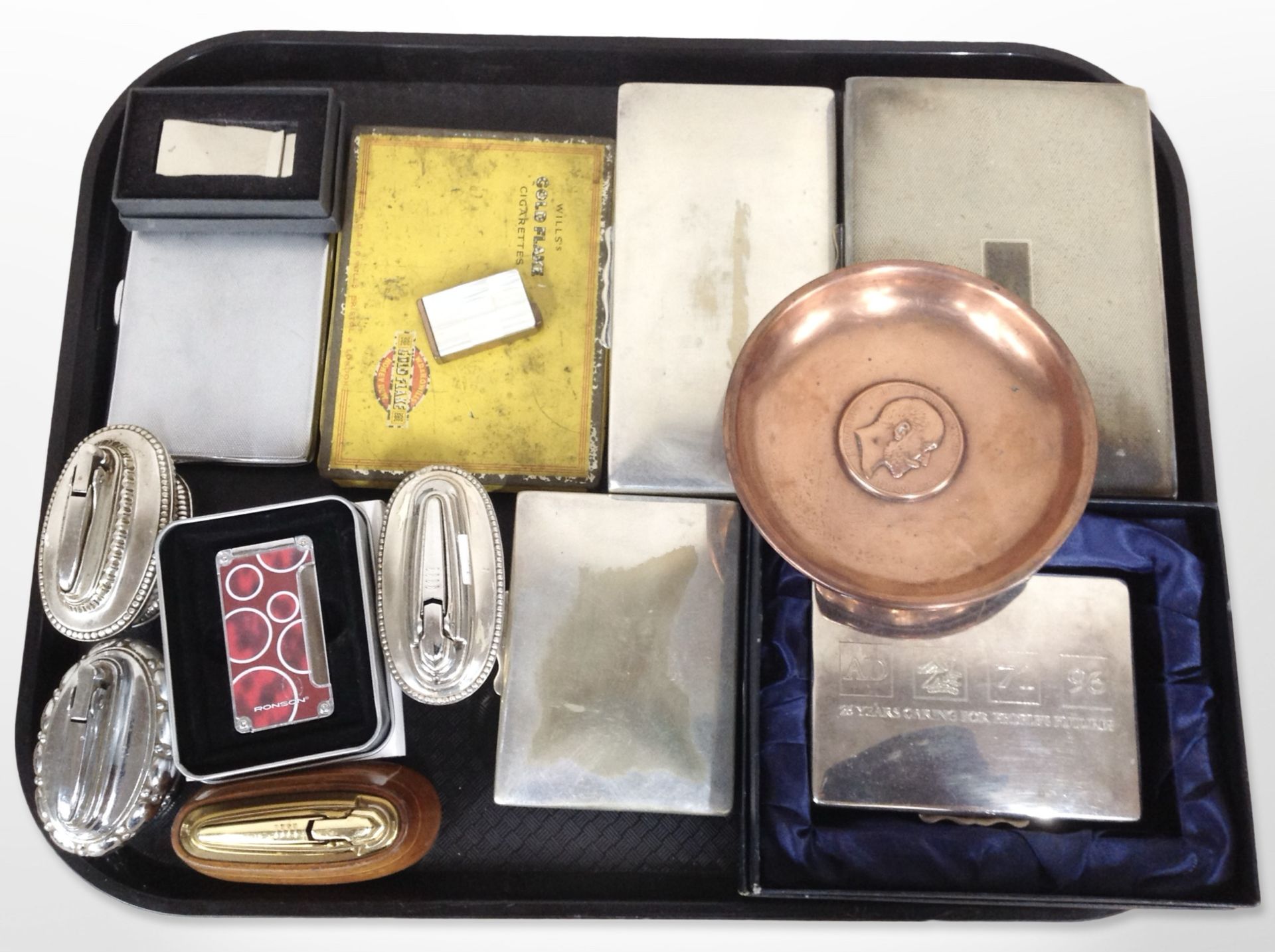 A group of table lighters, cigarette boxes, copper dish, etc.