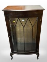 A reproduction mahogany glazed bow-front display cabinet, 61cm wide x 35cm deep x 113cm high.