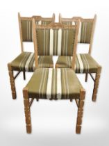 A set of three Danish oak-framed dining chairs in striped upholstery.