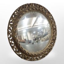 A gilt gesso convex porthole mirror, diameter 47cm.