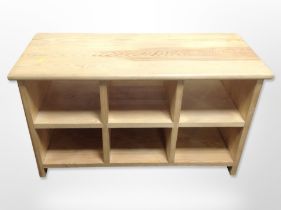 A contemporary pine six-compartment entertainment stand, 81cm wide x 36cm deep x 46cm high.