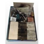 A group of costume jewellery, cutlery, monochrome portrait cards, small tin,