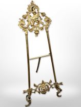 A gilt-brass table top easel stand,