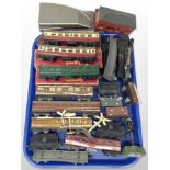 A group of tin plate and plastic OO gauge rolling stock including Tri-ang and Hornby.