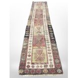 A flat weave kilim runner, 405cm x 85cm.