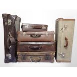 Six vintage leather and canvas luggage cases.