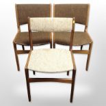 Three 20th-century Scandinavian teak-framed dining chairs.