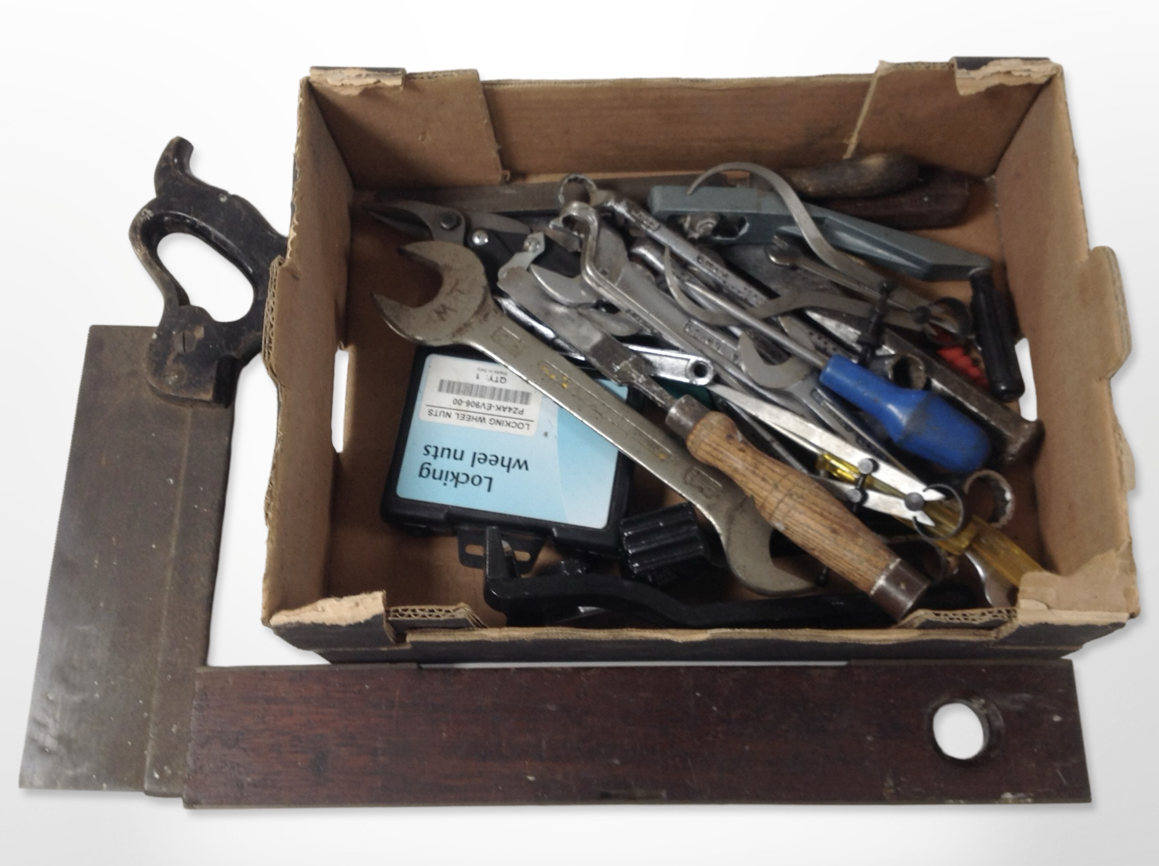 A group of vintage and modern tools including mahogany spirit level, hand saws, spanners, etc.