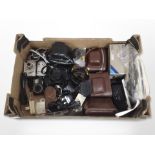 A group of vintage and modern cameras including Nikon, Sony, Agfa, various camera accessories.