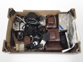 A group of vintage and modern cameras including Nikon, Sony, Agfa, various camera accessories.