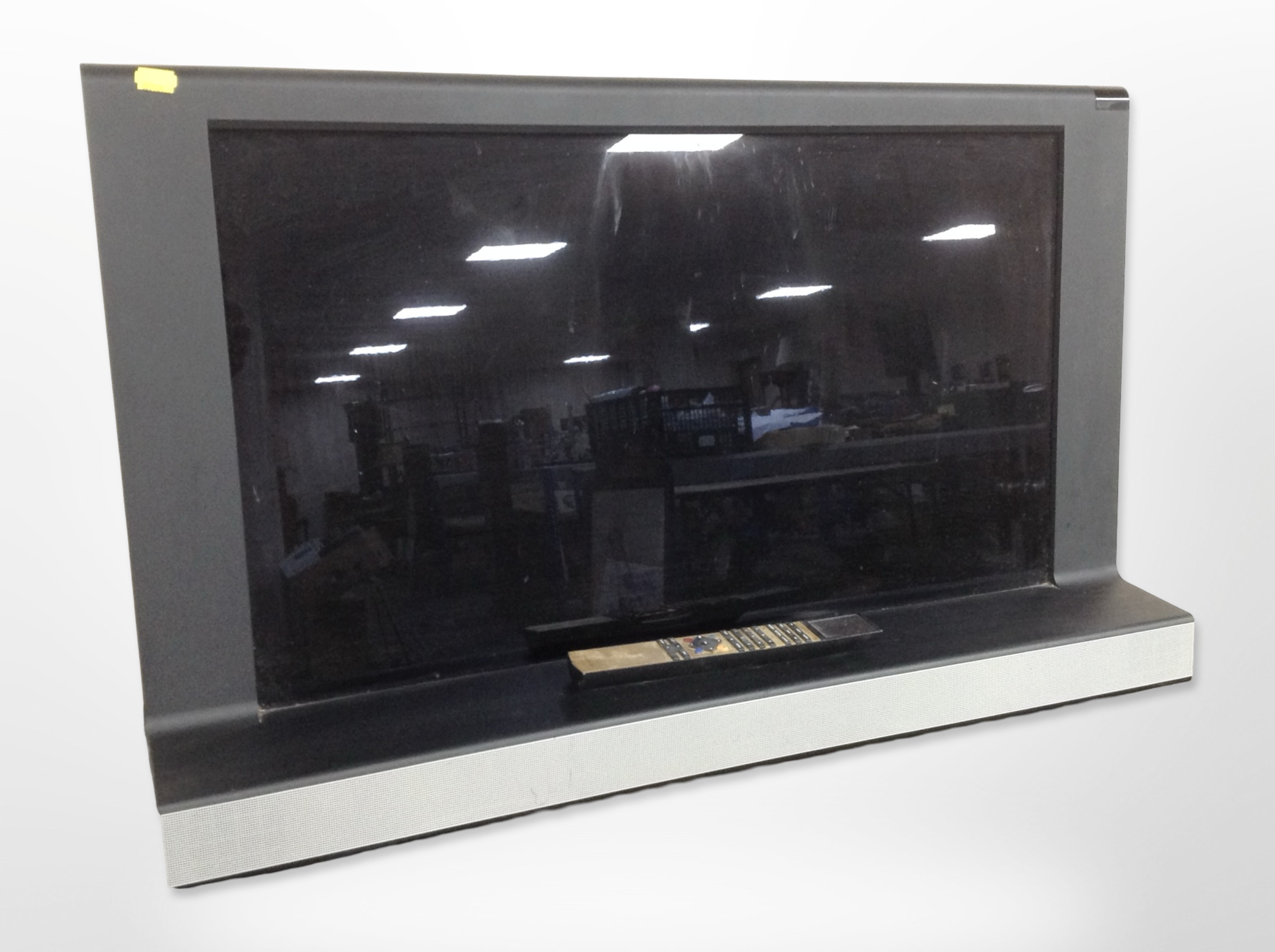 A Bang & Olufsen Beovision 32-inch TV with lead and remote.