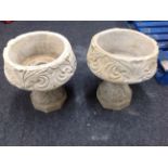 A pair of concrete acanthus leaf urns,