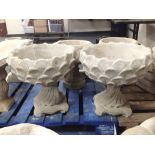 A pair of concrete "pineapple" urns,
