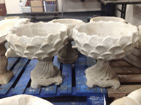 A pair of concrete "pineapple" urns,