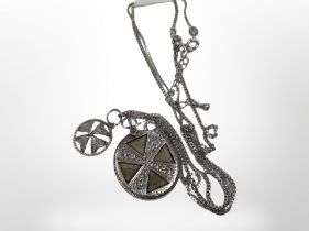 A Maltese cross pendant on silver chain and a Celtic pendant