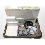 A Nintendo Wii console, Wii Fit board, and other accessories.
