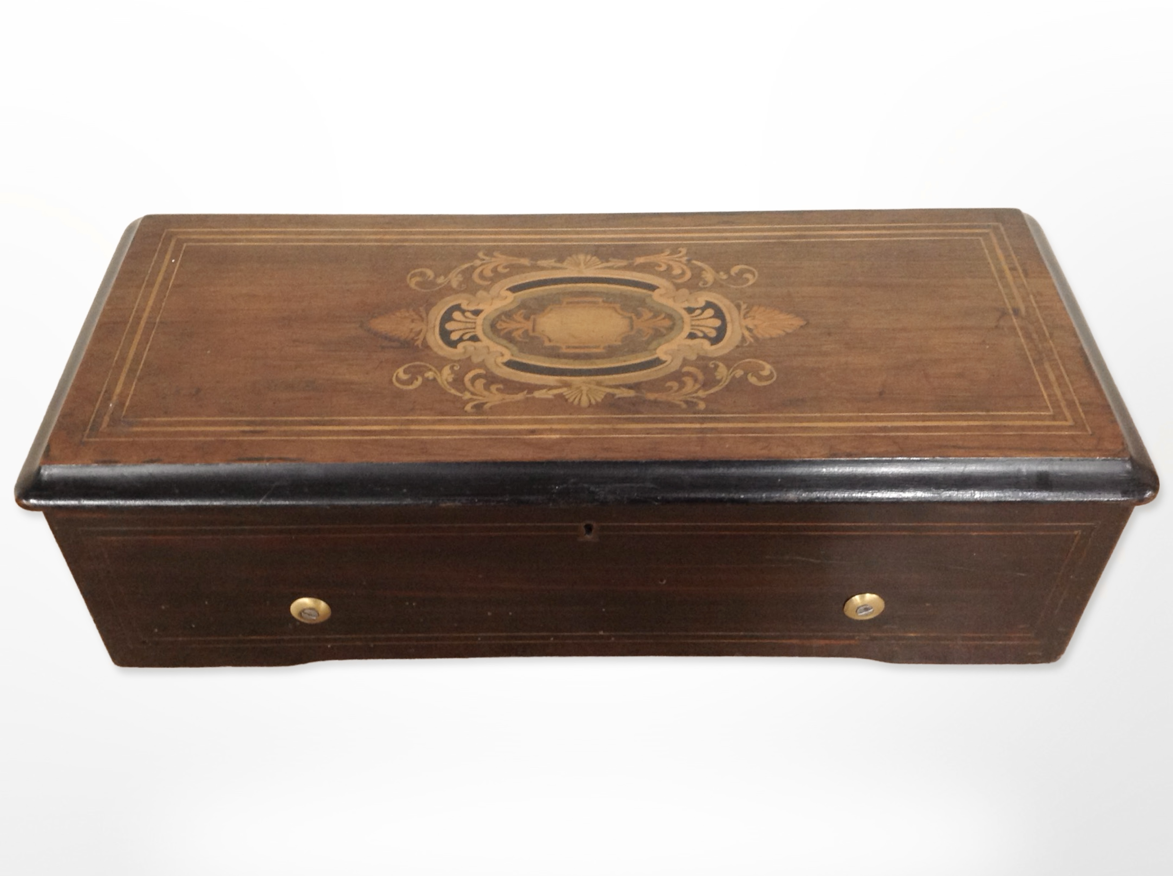 A 19th-century Swiss rosewood and satinwood strung cylinder music box, width 49cm.