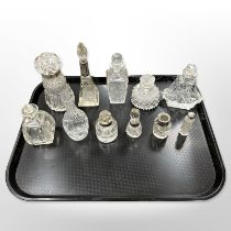 A group of antique cut glass scent bottles, some silver mounted,