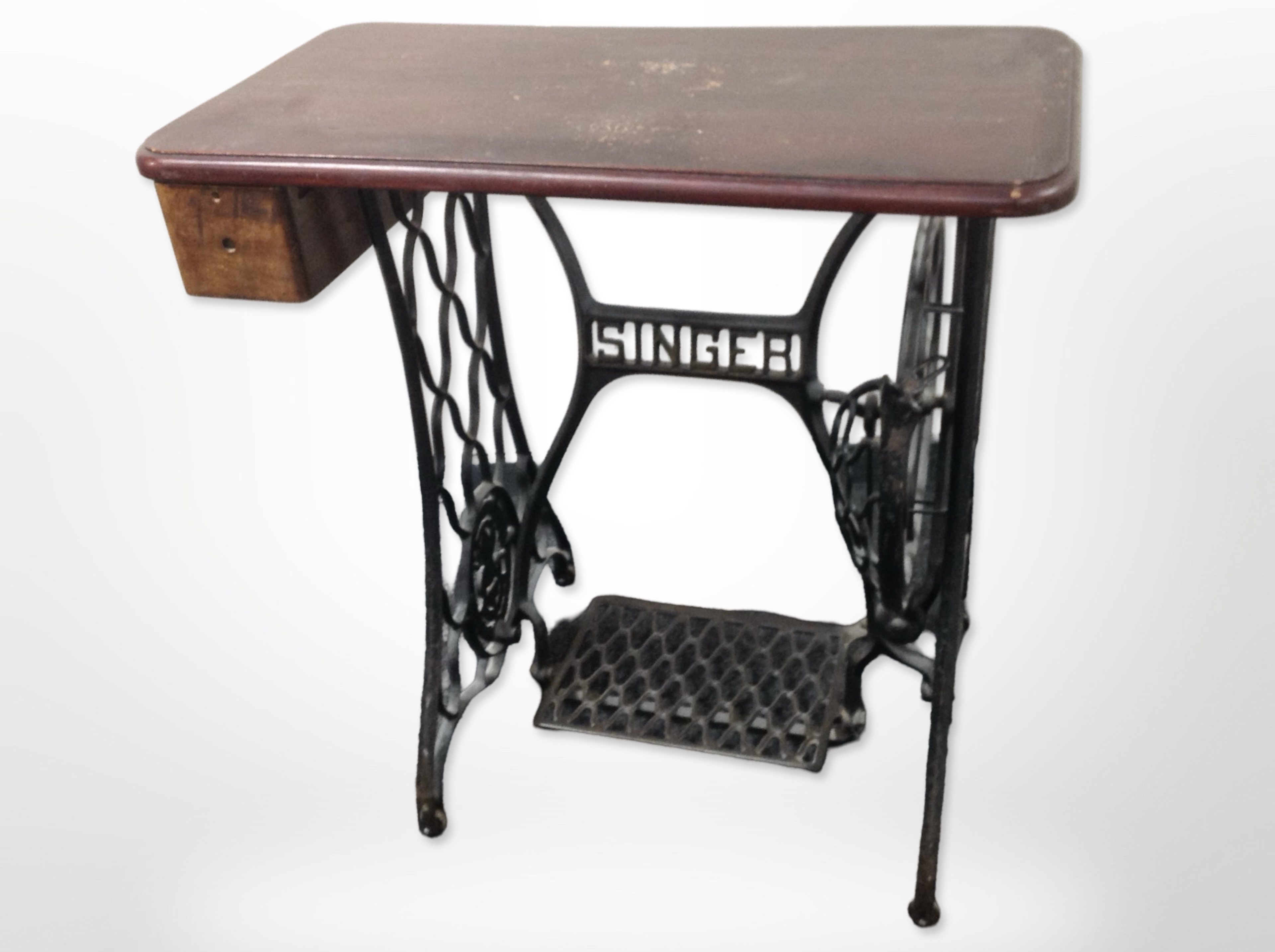 A cast-iron singer treadle sewing machine table, width 75cm.