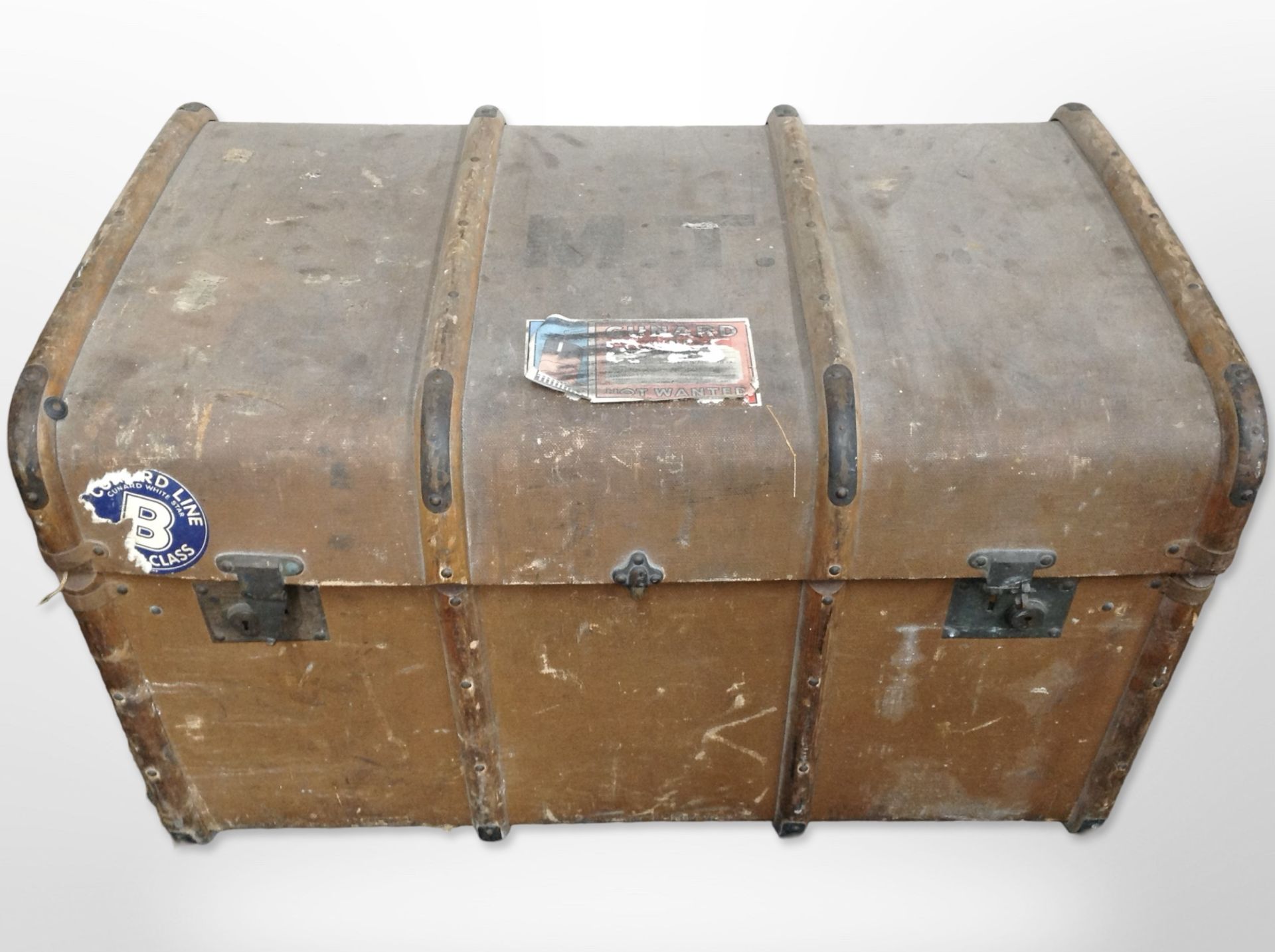 An early 20th-century canvas and wooden-bound trunk, length 84cm.