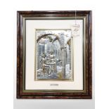 An Italian embossed silver relief picture depicting figures in a café between stone pillars,