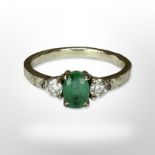 A 9ct white gold synthetic emerald dress ring, size L.