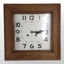 An Edwardian square oak wall clock, case 40cm wide, striking on a gong with pendulum.