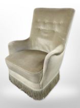 A mid-20th century salon armchair in olive buttoned dralon.