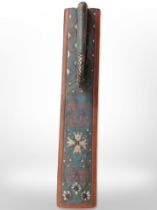 A 19th-century Scandinavian carved and painted pine mangle board, dated 1876, length 61cm.