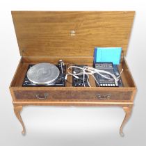 A Dynatron music system with Garrad 35 turntable, in yew wood cabinet, width 98cm.