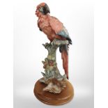 A Guiseppe Armani figure of a parakeet, height 40cm.
